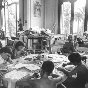 Pablo Picasso giving a drawing lesson to his children Paloma and Claude, and two friends. Photograph by Rene Burri / Magnum.