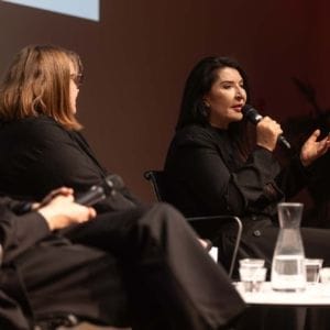 Rein Wolfs, Karen Archey and Marina Abramović at the conversation series Artist Talk at the Stedelijk Museum on March 17, 2024.