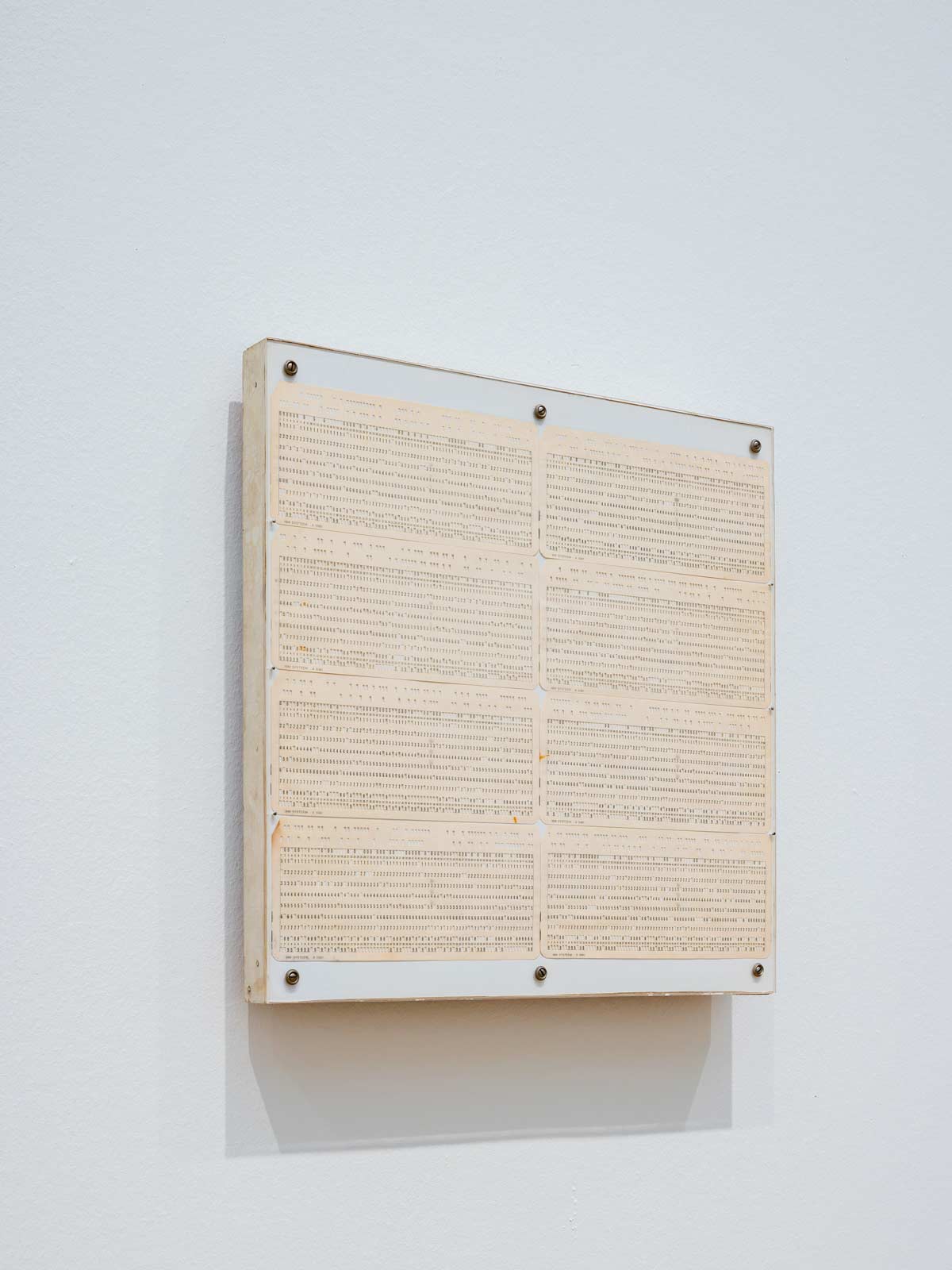 Fig. 1: Pieter Laurens Mol, OKVU komputerkaarten-akkumulatie-assemblage, 1968. Punch cards, ink on paper. 33.2 x 37.5 cm. Stedelijk Museum Amsterdam 2026. Photo: Peter Tijhuis